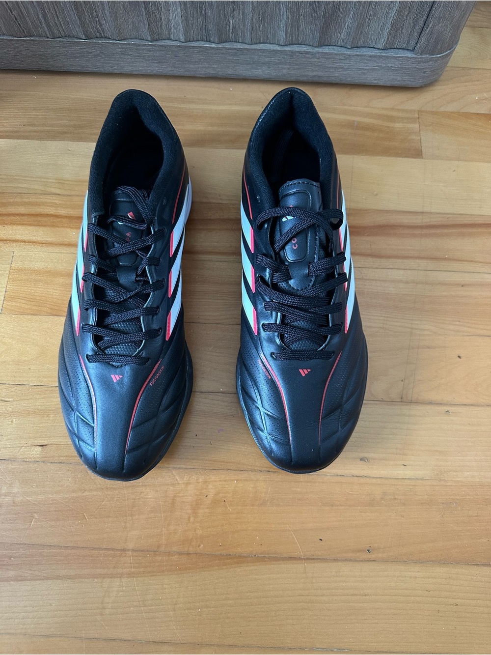 adidas Black Athletic Shoes with White and Red Accents